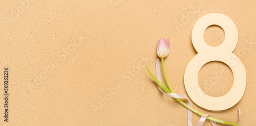 Creative greeting card for International Women's Day on beige background with space for text