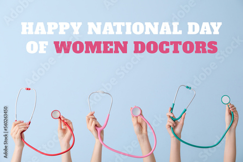 Greeting card for National Day of Women Doctors with many hands holding stethoscopes on light blue background photo