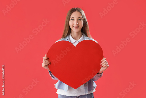Young woman with paper hear...
