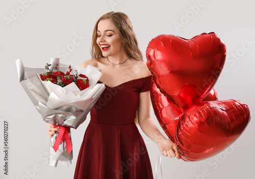 Happy young woman with hear...