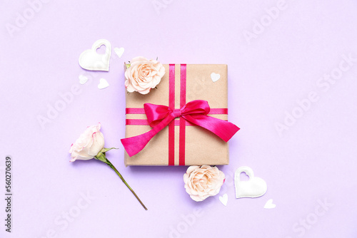 Composition with beautiful gift, decor and flowers on color background. Valentine's Day celebration © Pixel-Shot