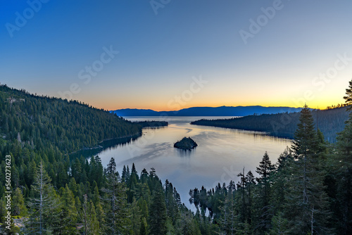 South Lake Tahoe viewed from the mountains with a body of water and small island in the middle with blue sky and room for text © Rich