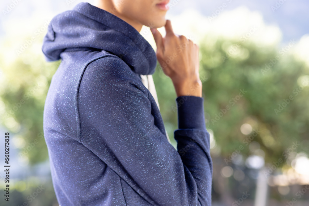 Image of biracial man in blue long sleeve hooded top with copyspace Image of biracial man in blue long sleeve hooded top with copyspace