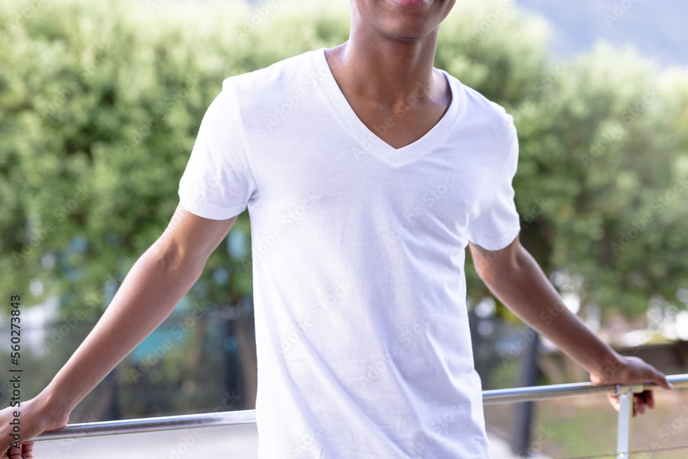 Fototapeta premium Image of african american man in white short sleeve t shirt with copyspace