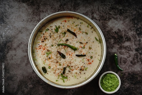 Spongy white dhokla - popular Gujarati steamed breakfast with rice or rava served with green chutney photo