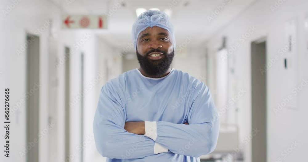 Video portrait of smiling african american male doctor in surgical cap and gown, copy space Video portrait of smiling african american male doctor in surgical cap and gown, copy space