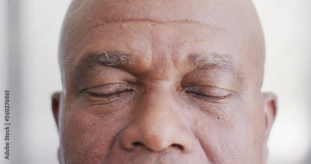 Video close up portrait of the opening eyes of senior african american male doctor Video close up portrait of the opening eyes of senior african american male doctor