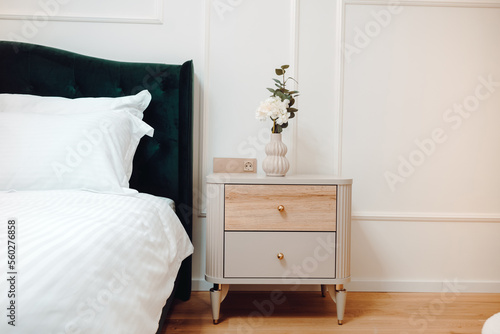 Furniture and accessories in modern bedroom of luxurious apartment