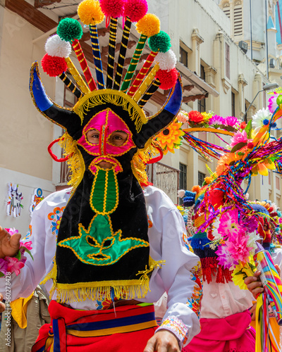 Dancer dressed as folk character called Diablo Huma (Devil)  on  carnival parade in Cuenca. Ecuador