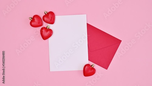 Wallpaper Mural Valentine's day greeting card with copy space paper, envelope and hearts on pastel pink background. Stop motion. Flat lay Torontodigital.ca