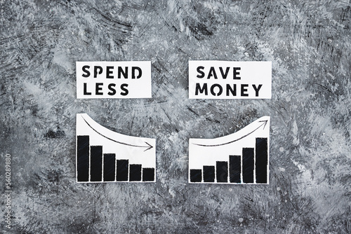 spend less and save money texs side by side with graphs showing expenses going down and savings going up photo