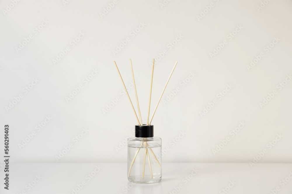 Aromatic reed air freshener on white table Aromatic reed air freshener on white table
