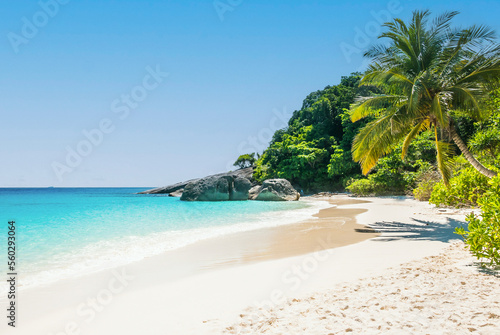 Beautiful tropical beach sea ocean with white cloud and blue sky background for travel vacation trip