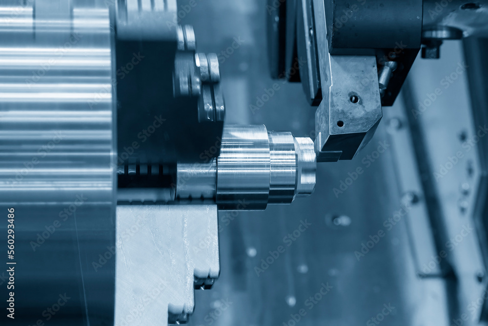 The CNC lathe machine forming cutting the metal shaft parts. The CNC lathe machine forming cutting the metal shaft parts.