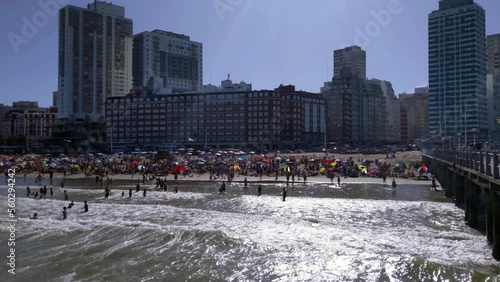 Tourists on the Beach in Mar del Plata City, Buenos Aires Province, Argentina. Slow Motion. 4K Resolution. photo