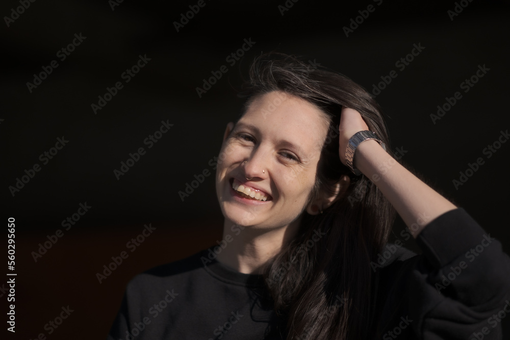 A model (they/them, White American) smiling and laughing. A model (they/them, White American) smiling and laughing.