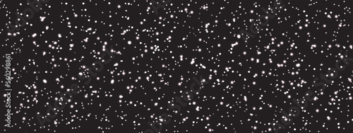 Abstract winter background, Falling Snow down on Black Background. White snowflakes flying in the air, Winter snow falling background with copy space. 