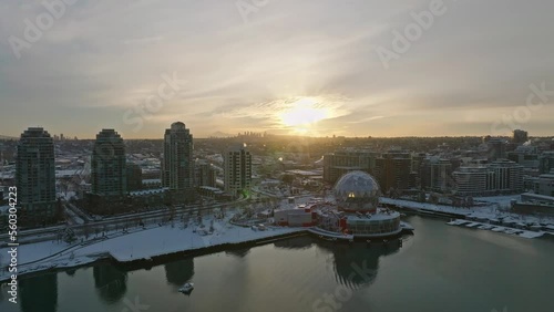 Vancouver Canda covered in winter snow - Science World ASTC building Downtown Area - Drone Aerial Sunset Shot photo