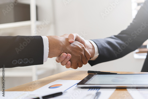 Support, business people, happy asian young man in suit, making handshake, shake hand together with partnership, customer or colleague after is done, successful. Worker meeting, congrats merger.
