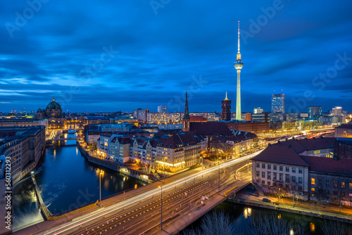 The center of Berlin with the famous TV Tower and a clouded sky at night © elxeneize