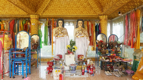 Statues of Nang Takhian couple is a ghost according to Thai folklore. It is a female ghost of the deities. resides in the takian tree. Buddhists worship for good fortune. At Phutthasuwan Chedi temple photo