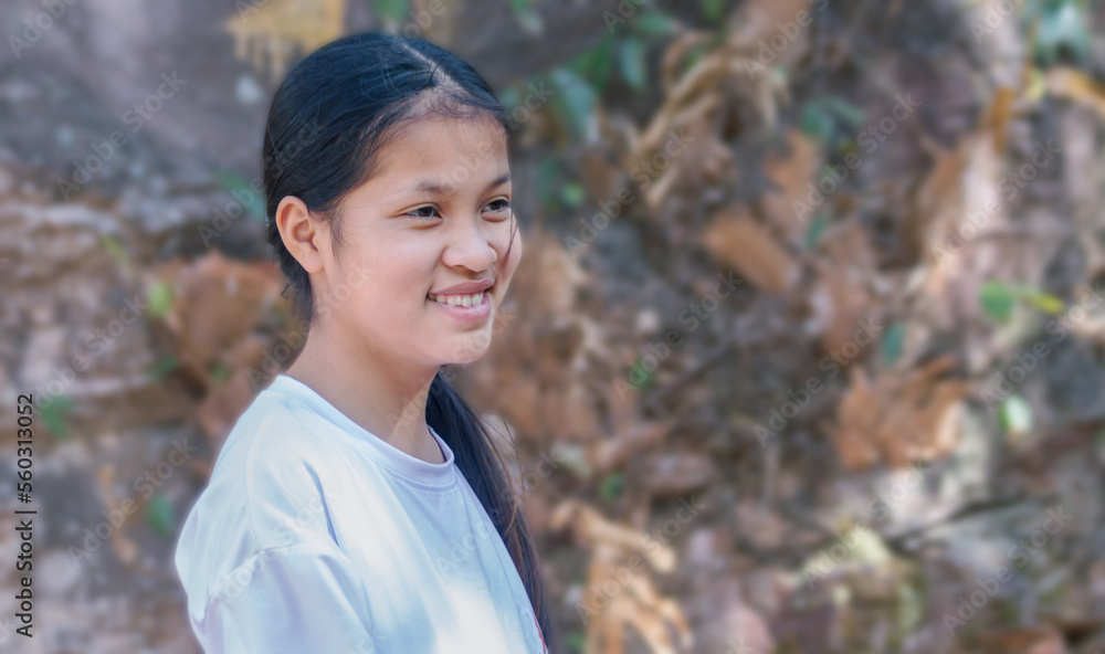Portrait of Asian girl with long hair smiling happily Portrait of Asian girl with long hair smiling happily