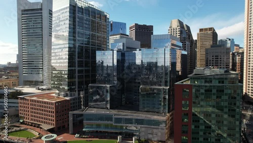 Aerial view orbiting Boston Intercontinental luxury waterfront hotel and downtown city skyline