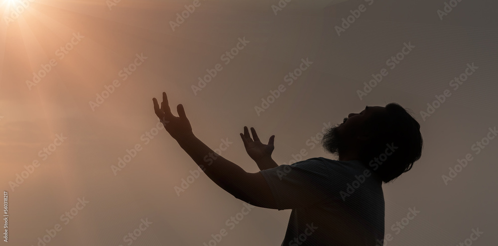 Worship with faith of christian concept. Spiritual prayer hands over sunshine with blurred beautiful sunrise sunset background. Preacher pray to God in morning with devotion. Christian man have hope.
