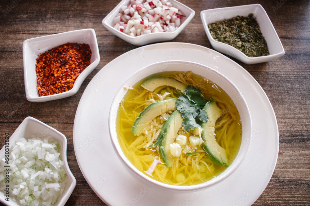 Pozole blanco con rábano, chile seco, orégano y cebolla Stock Photo ...