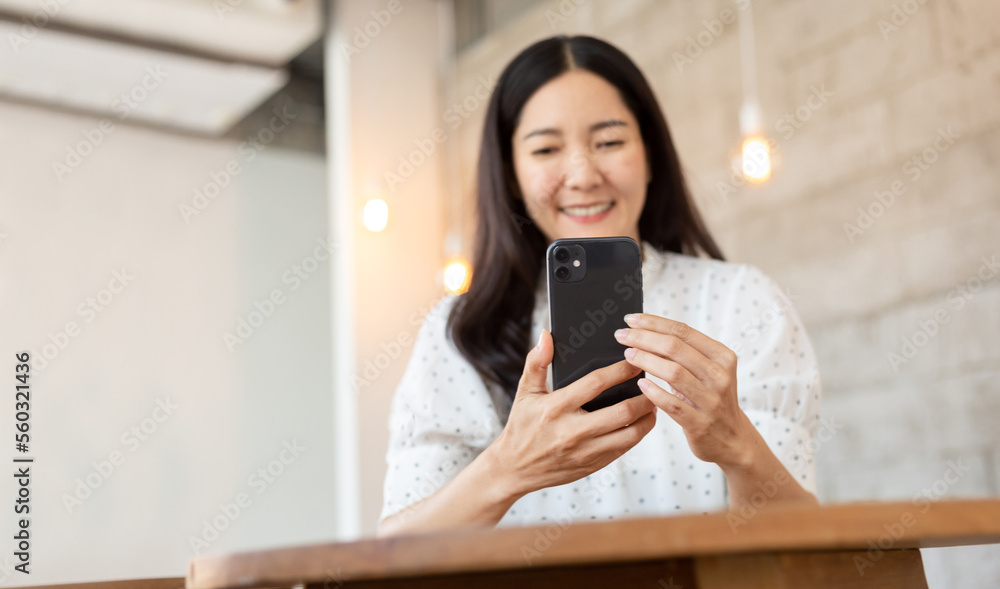 woman using cell phone hand holding mobile texting message contact us.chatting,search internet information.technology device communication connecting