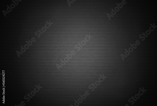 Black grey cardboard sheet texture background, detail of recycle dark paper box pattern.