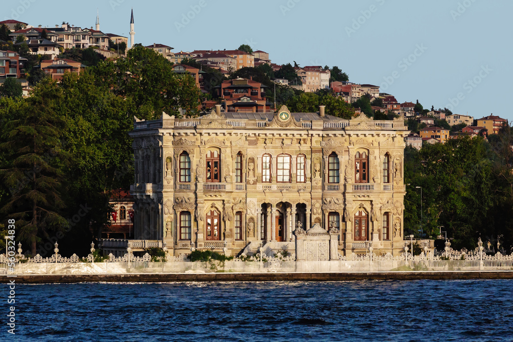 Panoramic view of Beylerbeyi Palace on a sunny day as seen from Bosphorus. Beylerbeyi meaning Lord of Lords is summer residence of Ottoman emperors. Uskudar district in Istanbul, Turkey (Turkiye).