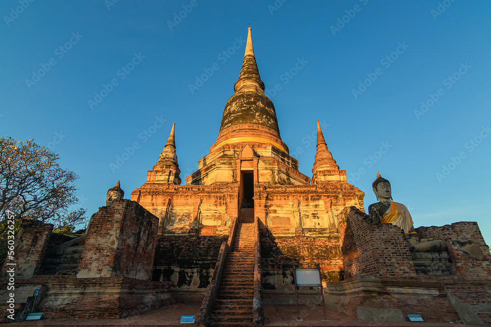 Fototapeta premium Buddha statues in front of Pagoda at Wat Yai Chai Mongkhon, Ayutthaya, Thailand, Unesco World Heritage Site.