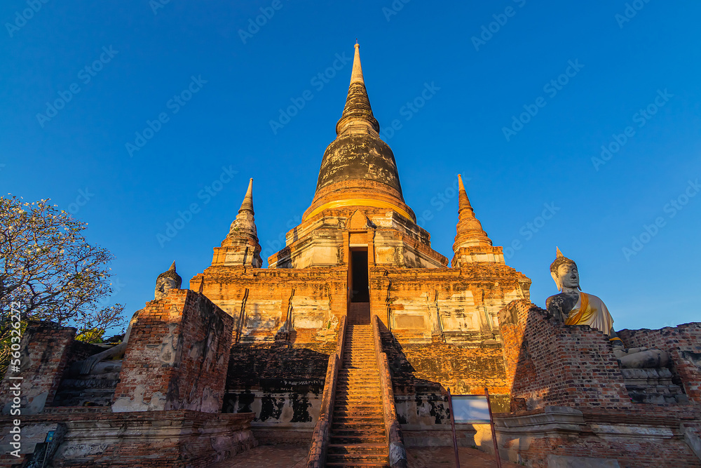 Fototapeta premium Buddha statues in front of Pagoda at Wat Yai Chai Mongkhon, Ayutthaya, Thailand, Unesco World Heritage Site.