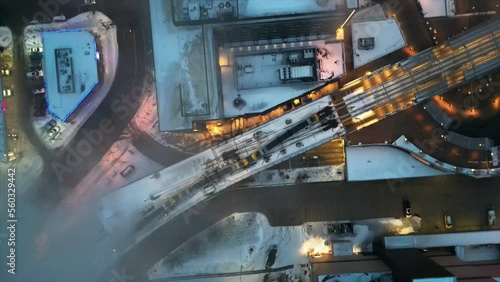 Aerial cinematic shot of Minneapolis through clouds over metro in winter photo