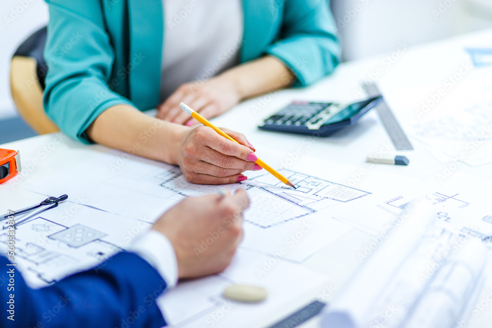 Close up photo of hands working with papers at office. Close up photo of hands working with papers at office.