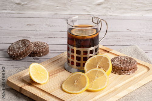 Morning tea and lemon on the table in the kitchen 