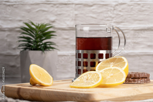 Morning tea and lemon on the table in the kitchen 