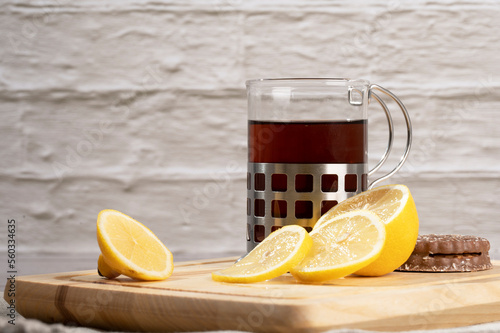 Morning tea and lemon on the table in the kitchen 
