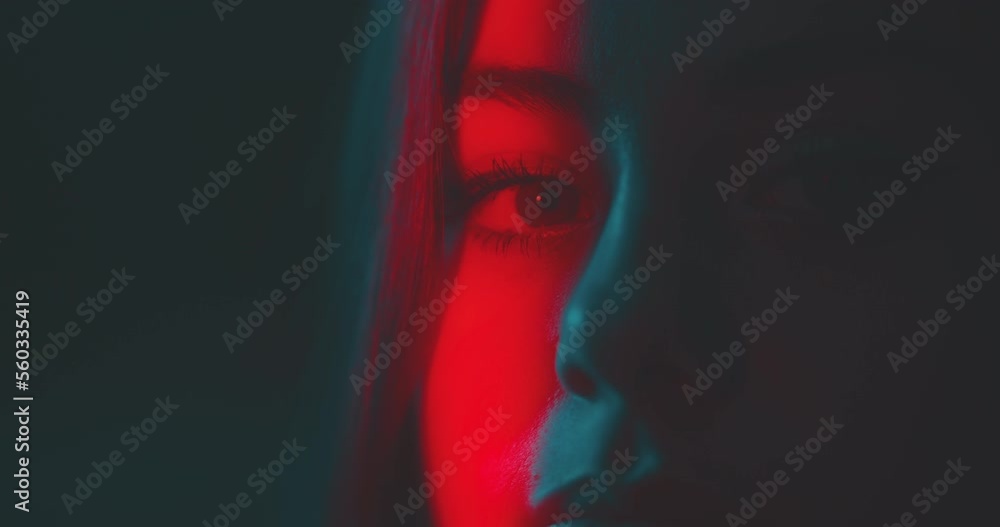 Close up of woman's face in red light Close up of woman's face in red light