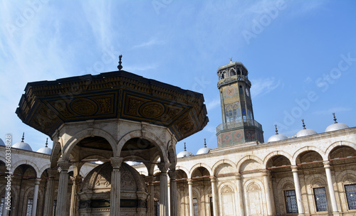 Ablution fountain and the clock tower in courtyard of The great mosque of Muhammad Ali Pasha or Alabaster mosque at the Citadel of Cairo, Salah El Din Castle, details of Mohamed Ali mosque courtyard photo