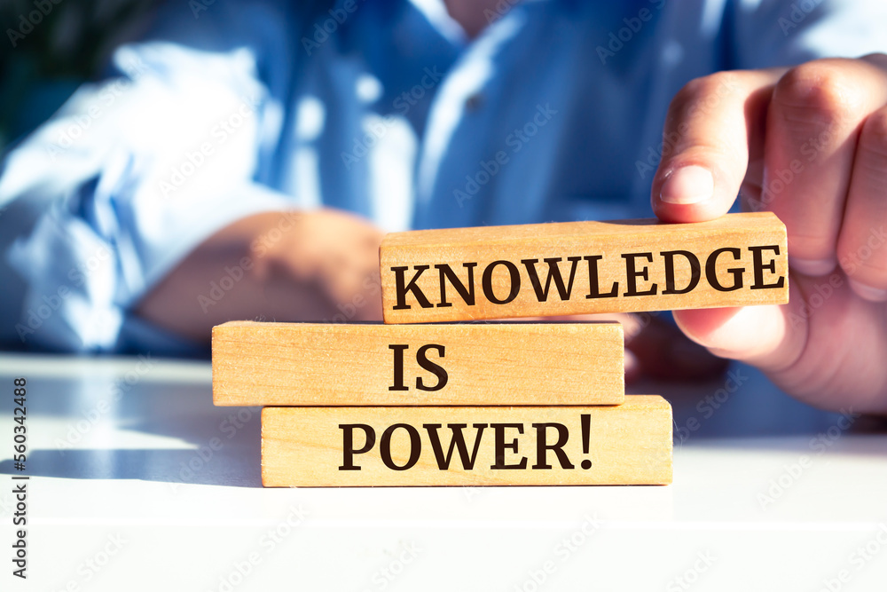 Closeup on businessman holding a wooden block with 