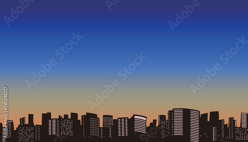 夕焼けのビル街イラスト素材　背景素材　コピースペース　16：9　夕日　ビジネス街