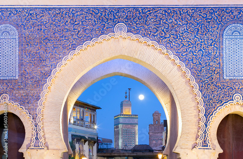 Bab Bou Jeloud gate (The Blue Gate) located at Fez, Morocco at sunset photo