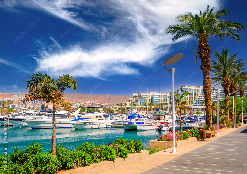 Marina and promenade with pleasure boats, surrounding hotels and shopping places in Eilat - famous tourist resort and recreational city in Israel