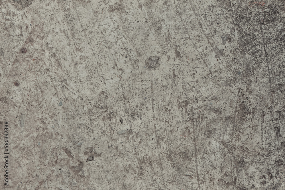 A concrete wall texture with cracks and scratches. Abstract background, old cement wall. A concrete wall texture with cracks and scratches. Abstract background, old cement wall.