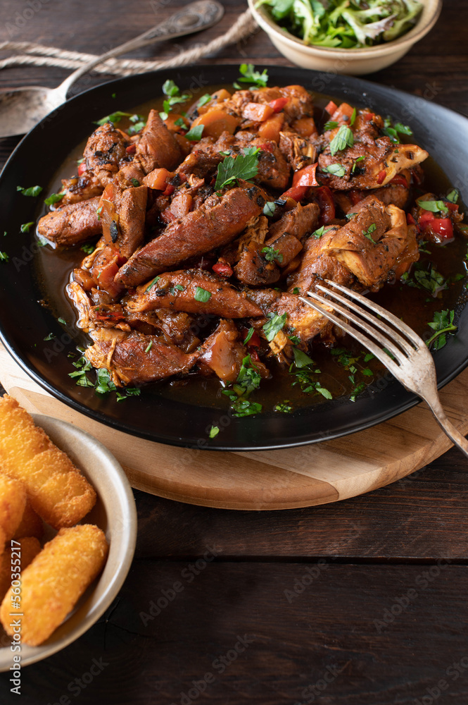 Stew chicken marinated with harissa sauce and cooked with vegetables. Stew chicken marinated with harissa sauce and cooked with vegetables.