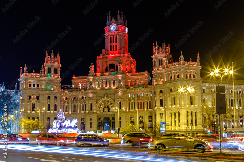 town hall and plaza de cibeles at night illuminated in red