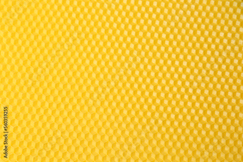 Natural beeswax sheet as background, top view
