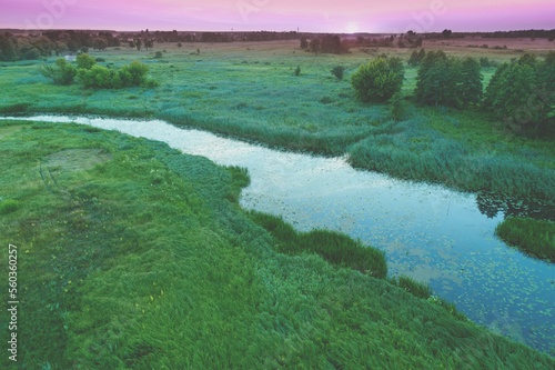 Aerial view of countryside and brook on a spring sunny day. Beautiful nature landscape in spring